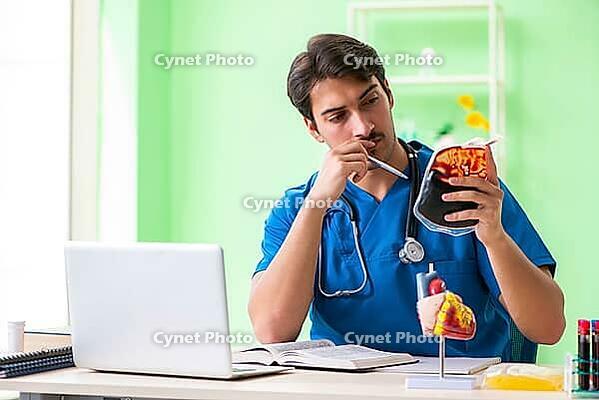 Doctor doing blood analysis in the lab [IBR125062186]