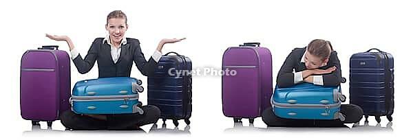 Woman with suitacases preparing for summer vacation [IBR125062198]