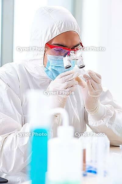 Young chemist student working in lab on chemicals [IBR125062209]