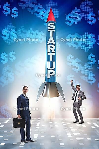 Start-up concept with rocket and businessman [IBR125062212]