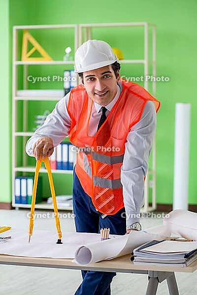 Man architect working on the project [IBR125062220]