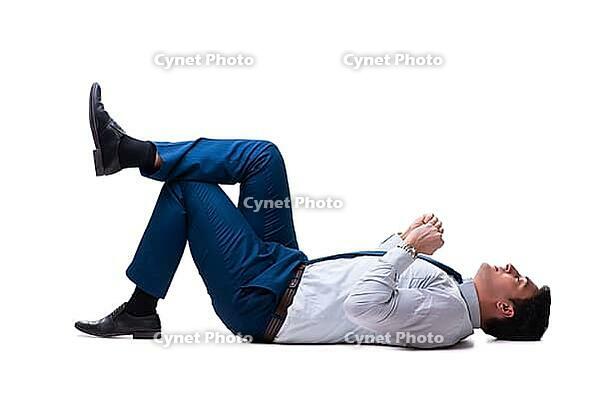 Businessman lying on the floor isolated on white [IBR125062223]