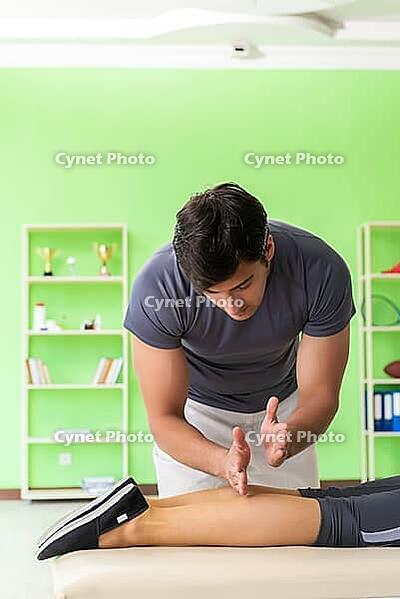 Young doctor chiropractor massaging patient [IBR125062234]