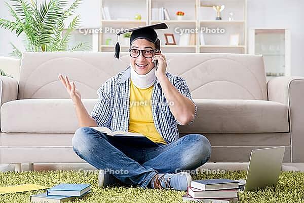 Student with neck injury preparing for exams [IBR125062237]