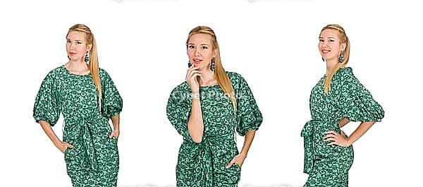Young woman in green dress isolated on white [IBR125075731]