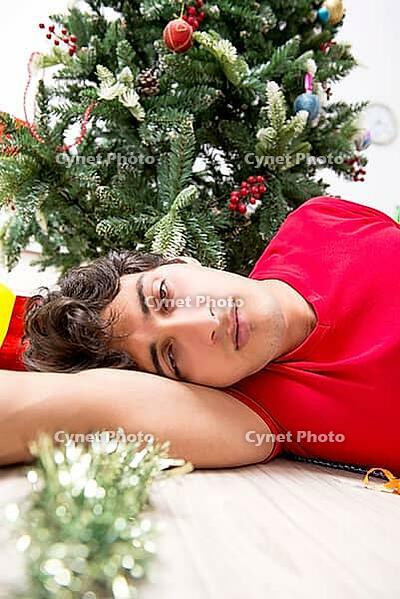 Young man drunk at home after christmas party [IBR125075752]