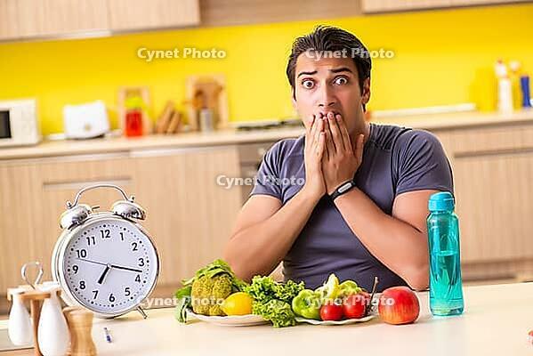 Young man in dieting and healthy eating concept [IBR125075765]