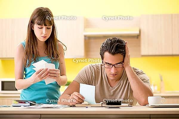 Young family struggling with personal finance [IBR125075805]