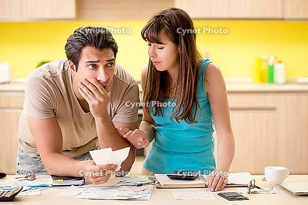 Young family struggling with personal finance [IBR125075808]