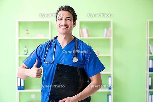 Young doctor working in the hospital [IBR125094349]