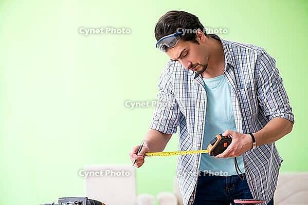 Woodworker working in his workshop [IBR125094400]