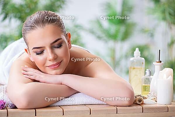 Woman during massage session in spa [IBR125094416]