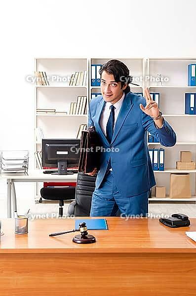 Young handsome judge sitting in courtroom [IBR125118023]
