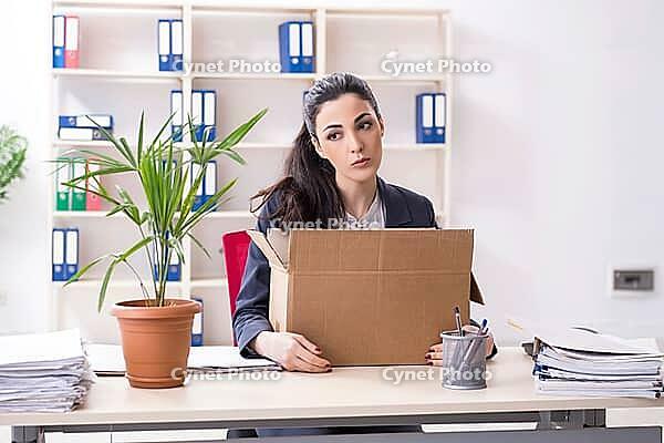 Young female employee being fired from her work [IBR125141675]