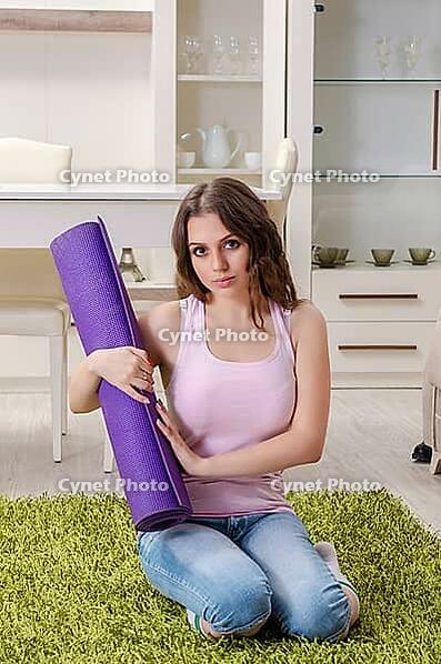 Young beautiful woman doing exercises at home [IBR125141685]