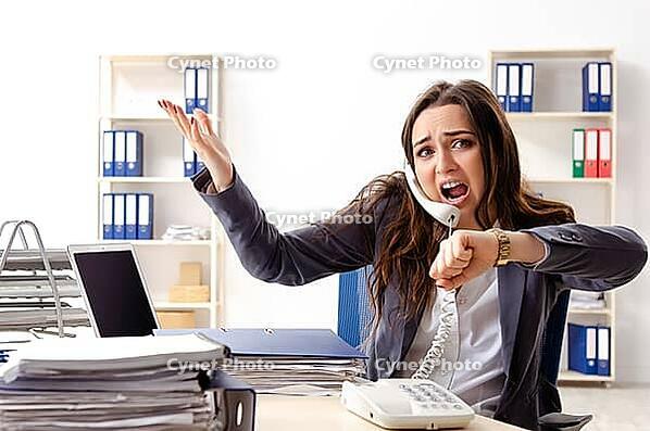 Young female employee unhappy with excessive work [IBR125141718]