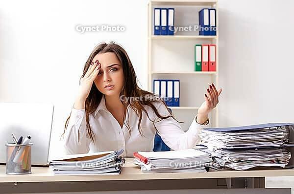 Young female employee unhappy with excessive work [IBR125141721]