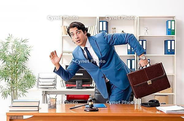 Young handsome judge sitting in courtroom [IBR125141722]