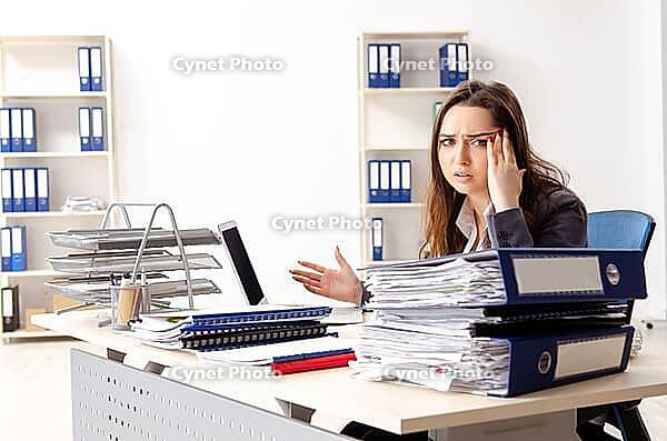 Young female employee unhappy with excessive work [IBR125141726]