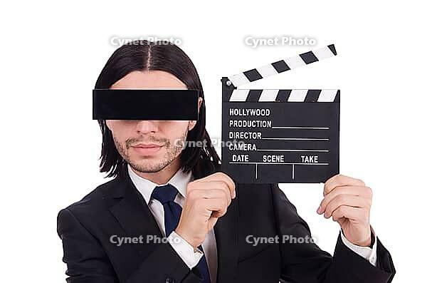 Man with movie board on white [IBR125141737]