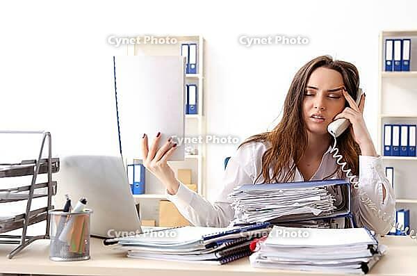 Young female employee unhappy with excessive work [IBR125141753]