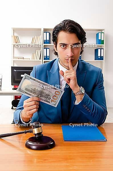 Young handsome judge sitting in courtroom [IBR125141757]