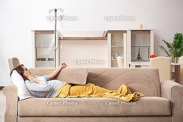 Sick pregnant woman suffering at home [IBR125141768]