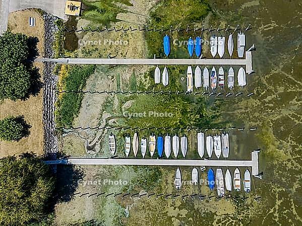 Drought on Lake Constance. The marina of Mannenbach-Salenstein in the canton of Thurgau is almost completely dry. Boats are dry at the dock and can no longer get into the water. aerial view. Mannenbach-Salenstein, Canton of Thurgau, Switzerland [IBR125163335]