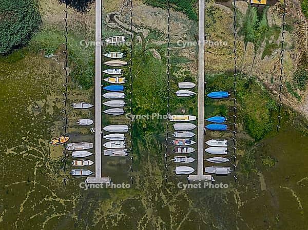 Drought on Lake Constance. The marina of Mannenbach-Salenstein in the canton of Thurgau is almost completely dry. Boats are dry at the dock and can no longer get into the water. aerial view. Mannenbach-Salenstein, Canton of Thurgau, Switzerland [IBR125163337]