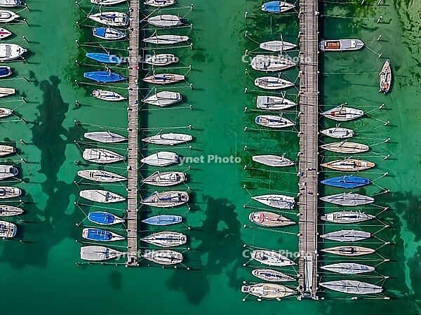 Marina of the Yacht Club Insel Reichenau. The lake bed can be seen in many shallow water zones. The water level of Lake Constance is currently low for the time of year. Reichenau, Baden-Württemberg, Germany [IBR125163343]