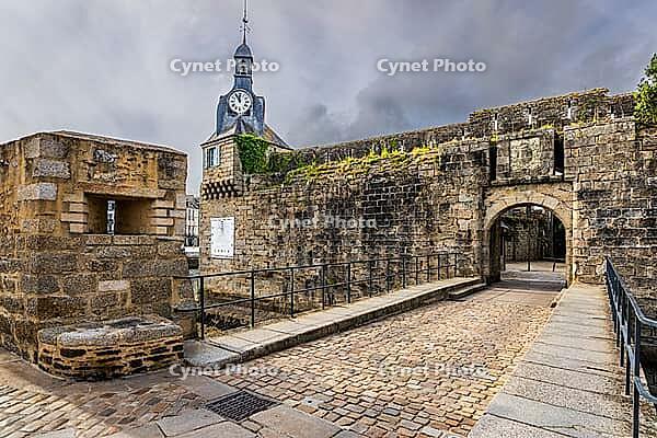 The old town and fortified Ville Close of Concarneau occupy a walled island in the Bay of Concarneau, Finistère, Brittany, France. Stone ramparts, towers, harbour buildings and surrounding water are visible in natural daylight, with the town opening towar [IBR125163362]
