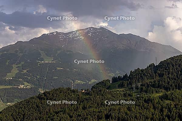 View over Turripiano, rainbow in the Bormio 3000 area, Valdidentro, Sondrio, Italy [IBR125163394]
