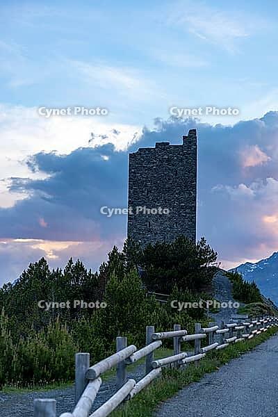 Torri di Fraele, historic watchtowers, with clouds at dusk, Valdidentro, Sondrio, Italy [IBR125163396]