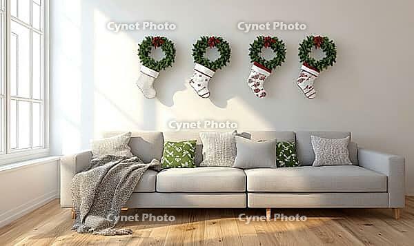 Scandinavian living room with natural wood floors, light grey couch, small green wreaths on the wall. AI generated [IBR125167425]