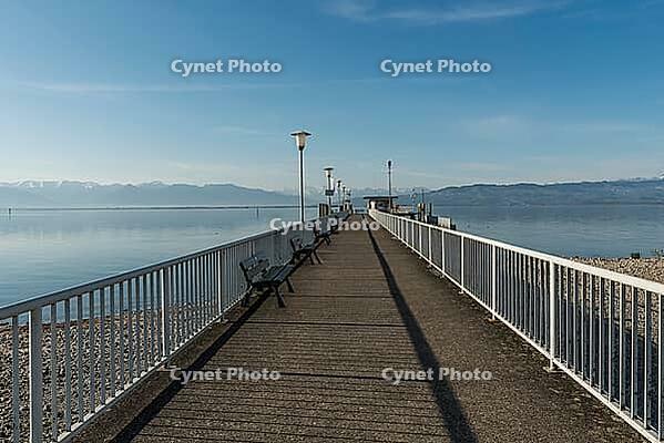 Jetty with a view of the Alps, moated castle am Lake Constance, Bavaria, Germany [IBR125173448]