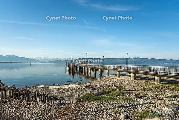 Jetty on Lake Constance at low tide in spring, moated castle, Bavaria, Germany [IBR125173449]