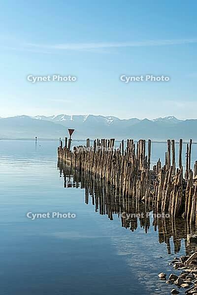 Wooden walkways on Lake Constance with a view of the Alps, moated castle, Bavaria, Germany [IBR125173455]
