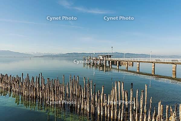 Shipping docks and wooden platforms on Lake Constance, moated castle, Bavaria, Germany [IBR125173458]