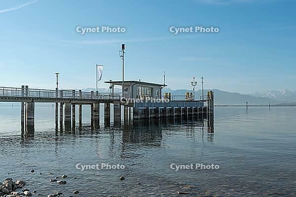 Jetty with a view of the Alps, moated castle am Lake Constance, Bavaria, Germany [IBR125173459]