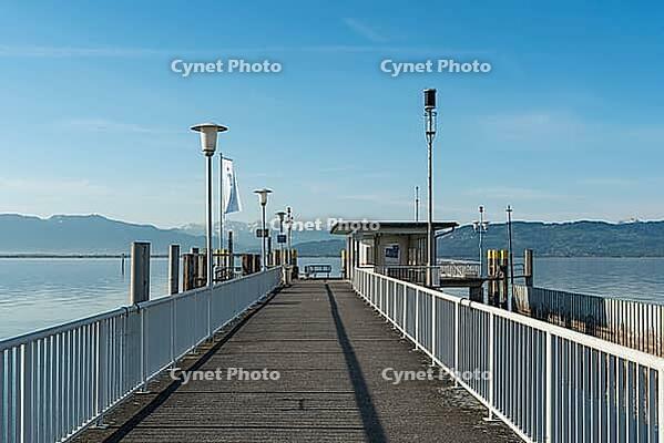 Jetty with a view of the Alps, moated castle am Lake Constance, Bavaria, Germany [IBR125173462]