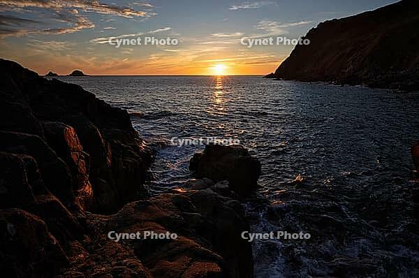 Evening, sunset at sea, The Brisons rock formation in the background, Cot Valley Beach, Porth Nanven, coast, St Just in Penwith, Cornwall, England, Great Britain, Great Britain [IBR125177979]