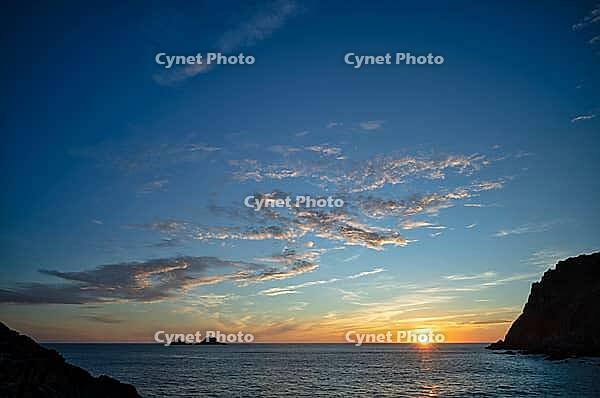 Evening, sunset at sea, The Brisons rock formation in the background, Cot Valley Beach, Porth Nanven, coast, St Just in Penwith, Cornwall, England, Great Britain, Great Britain [IBR125177988]