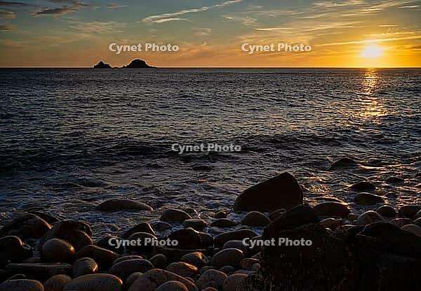 Evening, sunset at sea, in the background rock formation The Brisons, Cot Valley Beach, Porth Nanven, also beach of dinosaur eggs, coast, St Just in Penwith, Cornwall, England, Great Britain, Great Britain [IBR125177991]