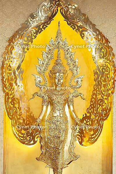 Symbolic depiction of the Buddha as an enlightened, radiant and regal figure in princely regalia, with a flame-shaped ornamental halo (aureole), at the Buddhist temple complex of Wat Phra That Sorn Kaew, Khao Kho Mountains, Phetchabun Province, Isan, Thai [IBR125178014]