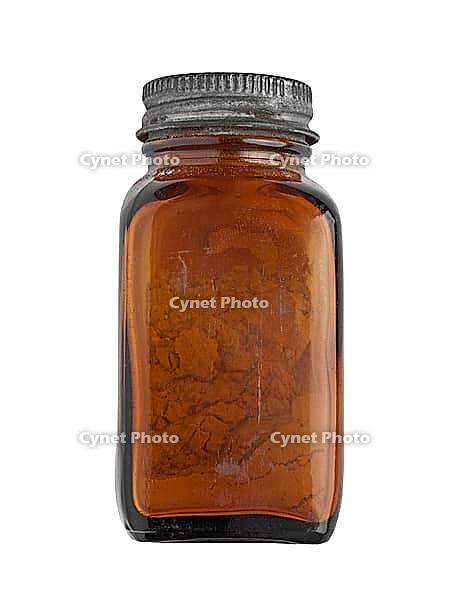 Vintage brown glass spice bottle over white, clipping path [IBR125188185]
