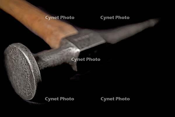 Vintage auto bodywork hammer over black background [IBR125188243]