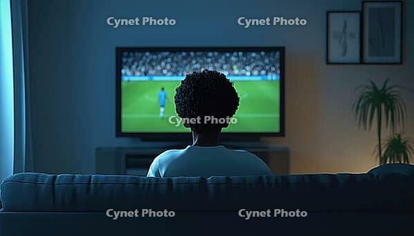 Unrecognizable Biracial Man Sitting On Sofa In Living Room Watching Soccer Game Match On Tv With Copy Space Available, AI generated [IBR125200734]
