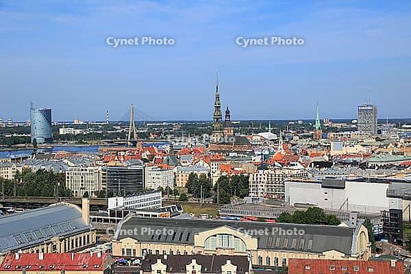 Old town with St. Peter's Church and St. Mary's Cathedral, Daugava with Vansubrücke, in front market halls, seen from the high-rise building of the Academy of Sciences, Riga, Latvia [IBR125203136]