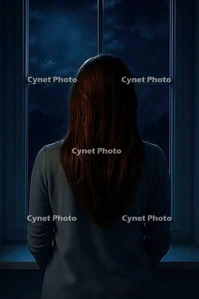 A woman gazes out a window into a dark, cloudy night sky, evoking a moody, introspective atmosphere, AI generated [IBR125203223]