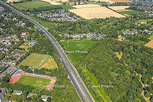 Aerial view, A2 motorway, possible and planned route for regional railway between Kamen and Bergkamen, Jahnstadion, soccer player on the side square, railway infrastructure, road traffic and truck traffic, Kamen, Ruhr area, North Rhine-Westphalia, Germany [IBR113322292]